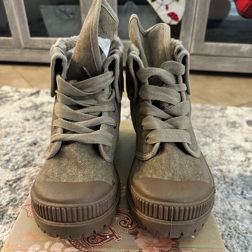 New. Never worn. Taupe Combat boots with faux insulation